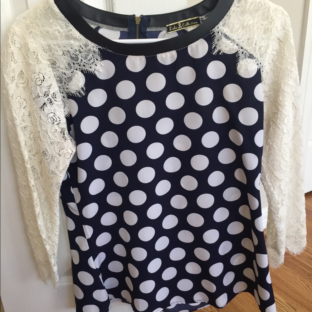 Navy and white polka dot blouse